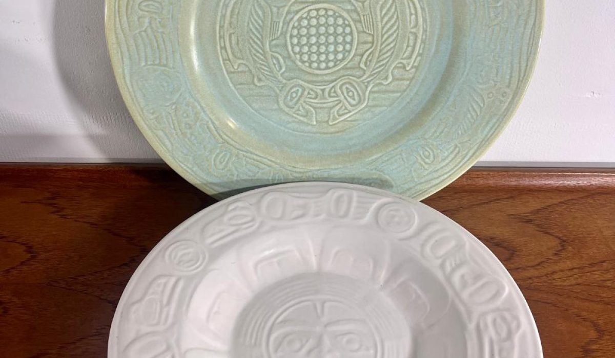 Lyle Wilson. Raven (white plate) and Salmon (green plate. Pottery. No date. (This entry is for Raven).
